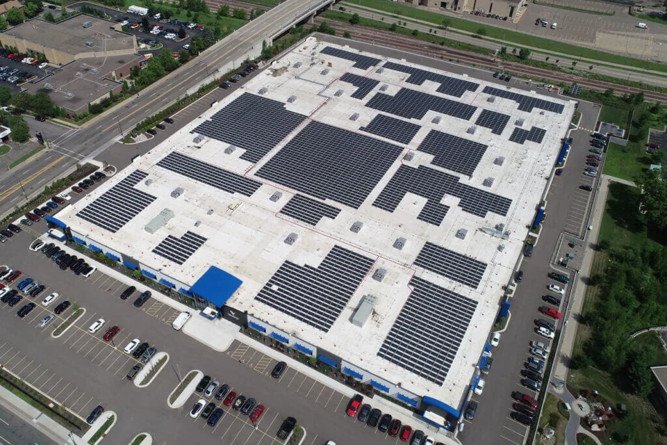 Aerial view of solar panels covering the Vomela rooftop.