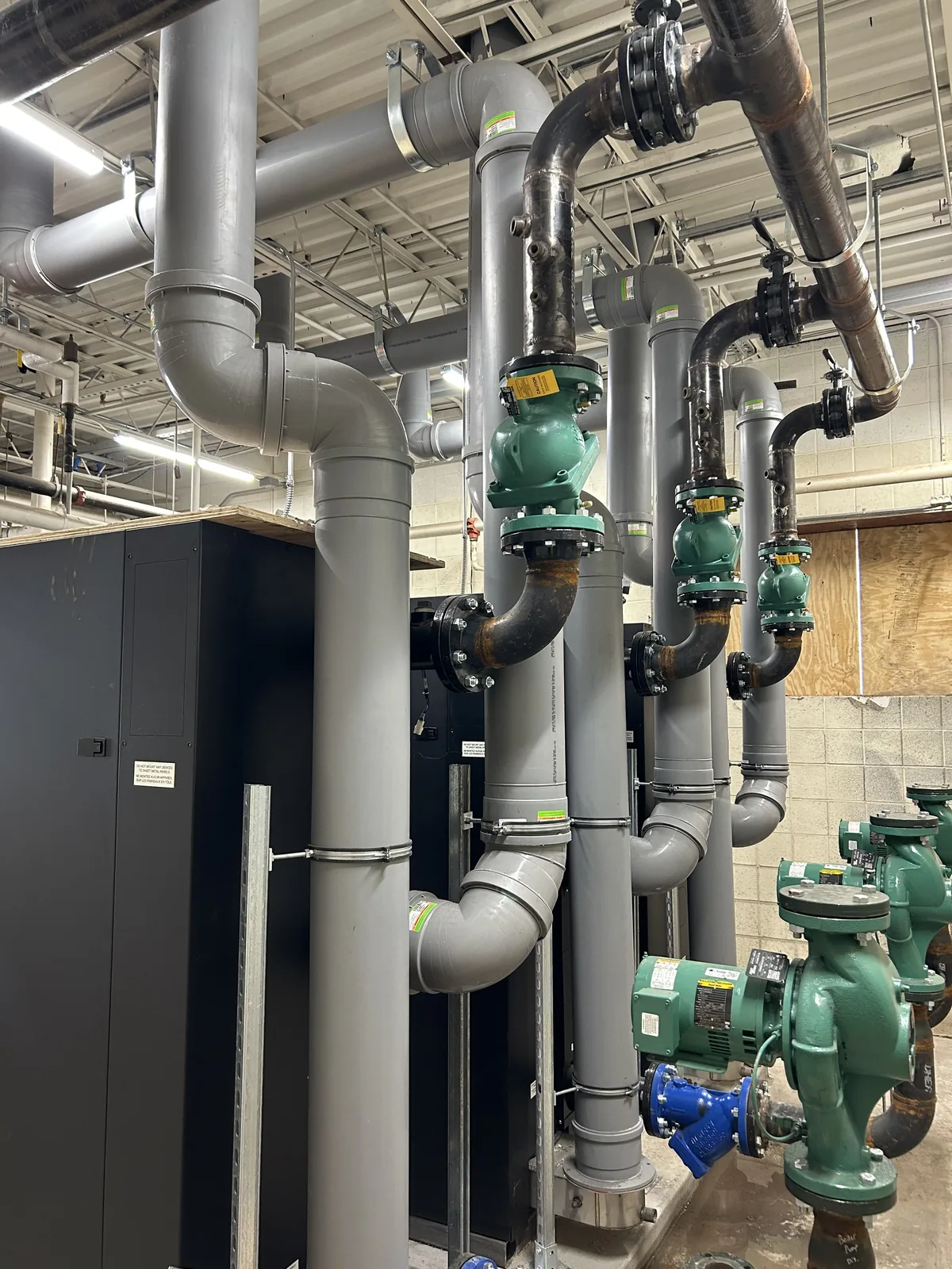 Custom metal boiler venting and piping installed in the Wyoming Elementary School mechanical room.