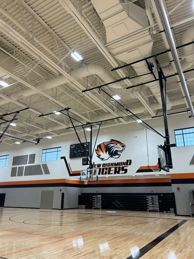 Gymnasium at New Richmond Middle School with HVAC equipment above the court.