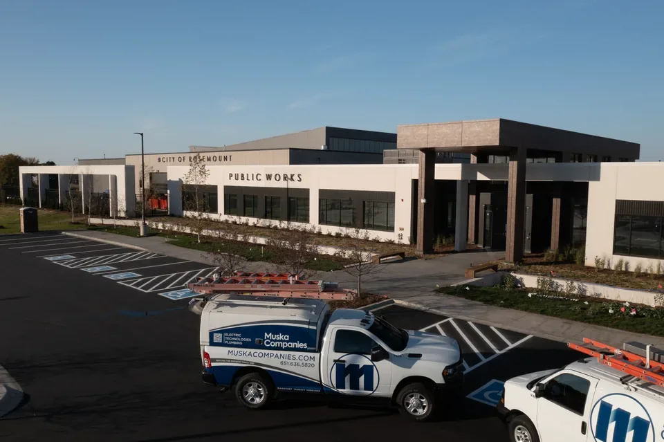 Exterior of the Rosemount Police & Public Works building and service vehicles.
