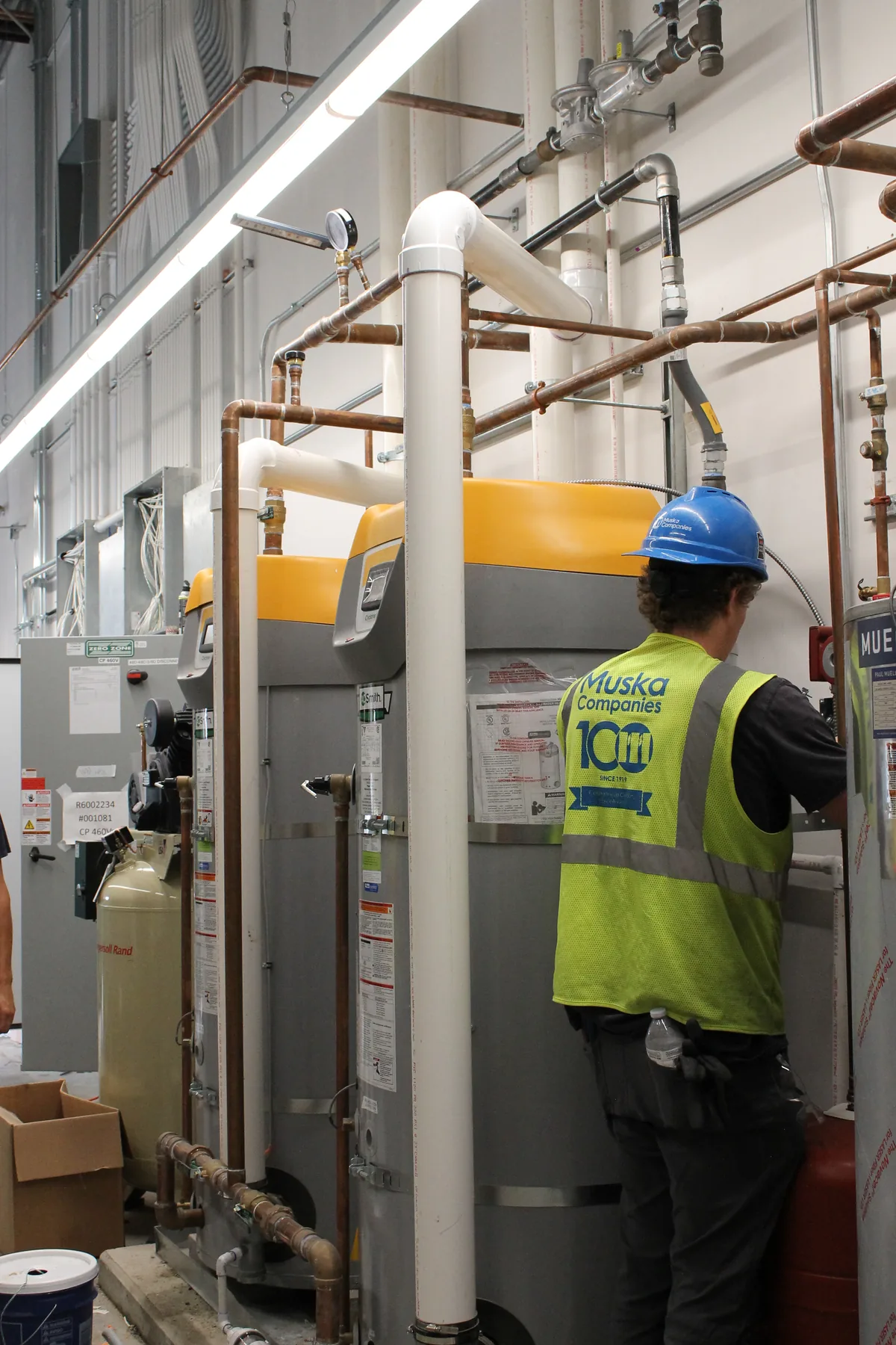 Industrial piping and plumbing equipment in a service area.