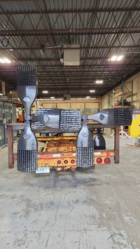 Large assemblies staged on a truck inside the pre-fabrication shop.