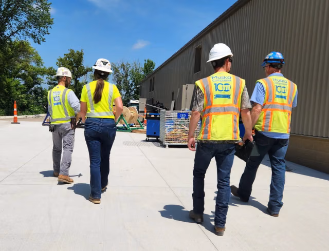 Muska team members and safety partners walking a Costco Wholesale project site